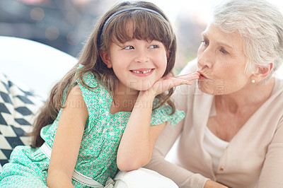 Buy stock photo Shot of a loving grandmother and granddaughter spending time together at home