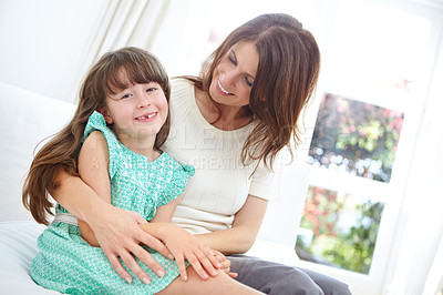 Buy stock photo Portrait of a cute little girl spending time with her mother at home