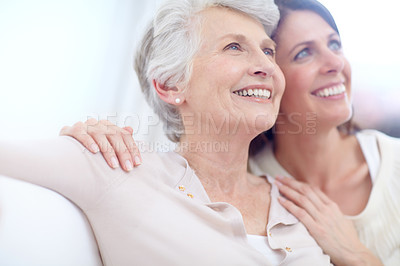 Buy stock photo Shot of an affectionate mother and daughter spending time together at home