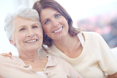 Buy stock photo Portrait of an affectionate mother and daughter spending time together at home