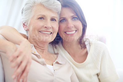 Buy stock photo Portrait of an affectionate mother and daughter spending time together at home