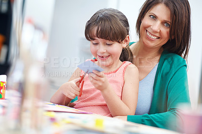 Buy stock photo Shot of a mother and daughter having fun being creative