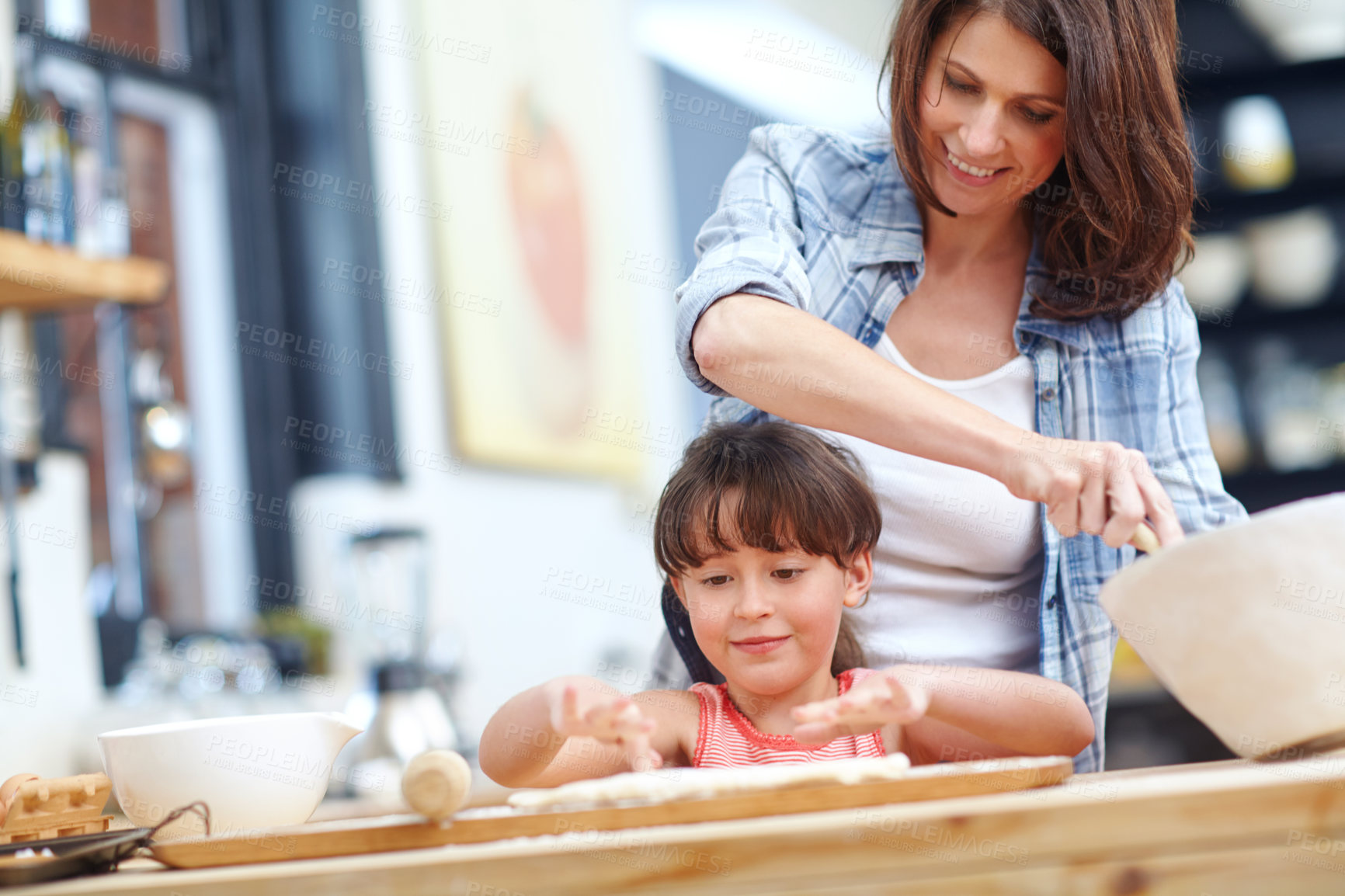 Buy stock photo Shot of a mother and daughter baking together