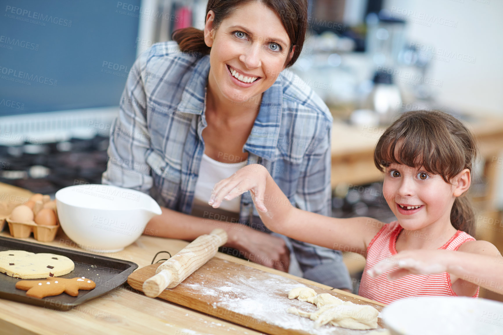 Buy stock photo Shot of a mother and daughter baking together