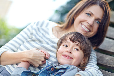 Buy stock photo Shot of a mother and daughter lying together on a hammock