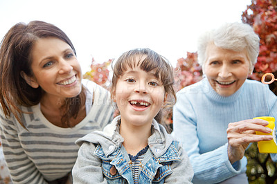 Buy stock photo Portrait of a little girl having fun with her mother and grandmother