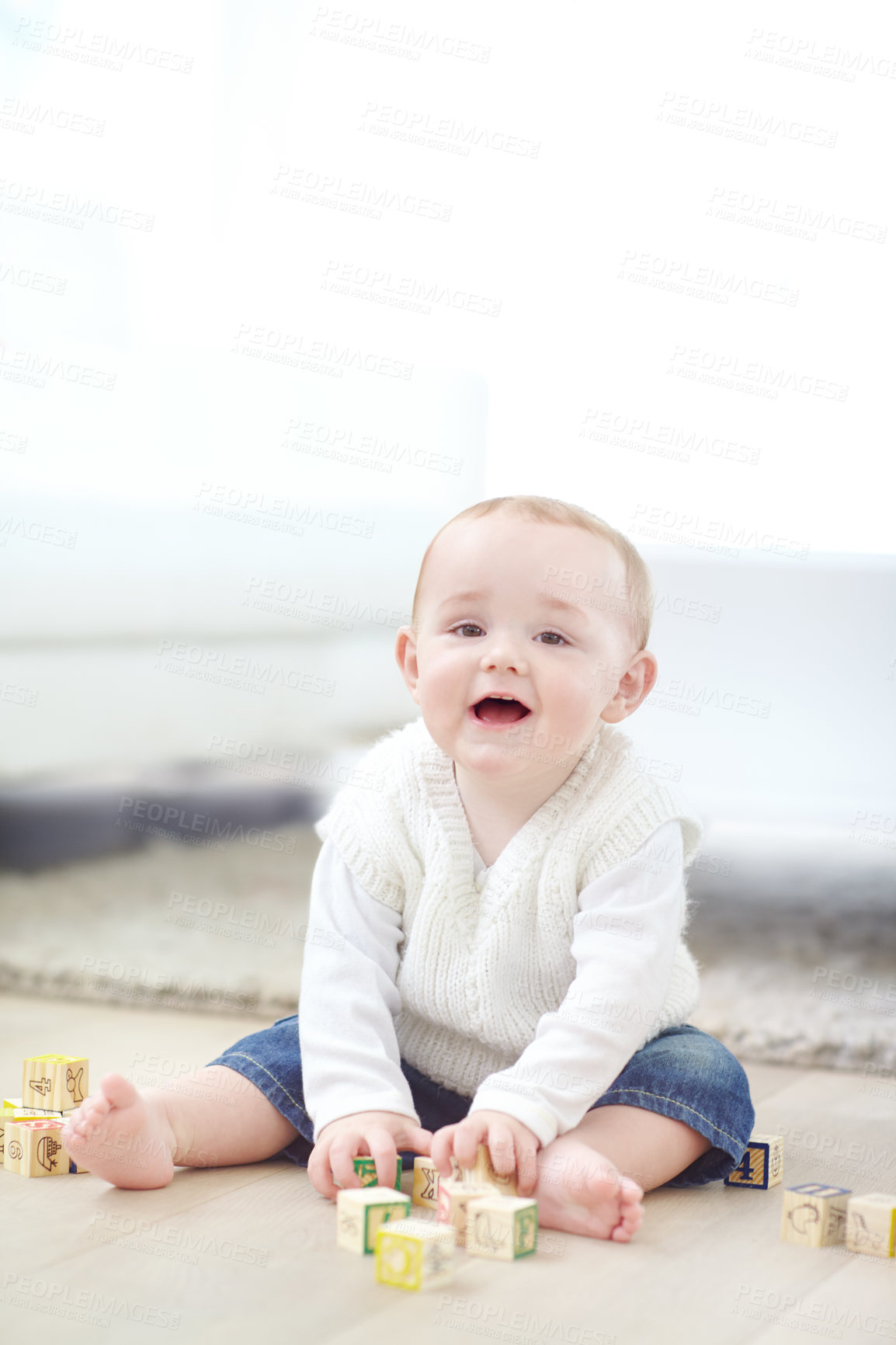 Buy stock photo Boy, toddler portrait or playing with blocks on floor for childhood development or cognitive learning. Happy, child or kid with wooden toys for fine motor skills, coordination or building in home