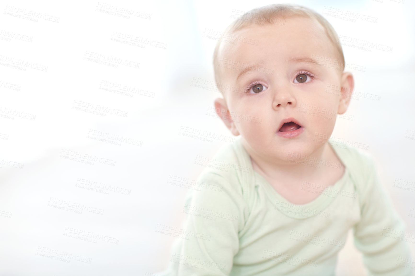 Buy stock photo Shot of an adorable little boy sitting on the floor