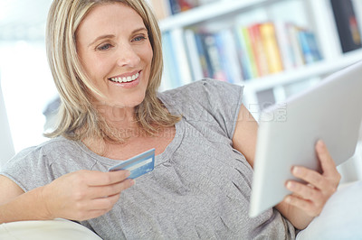 Buy stock photo Banking, credit card and happy woman with tablet in home for online shopping, investment and payment. Smile, technology and finance for ecommerce, money and virtual sales on discount in living room