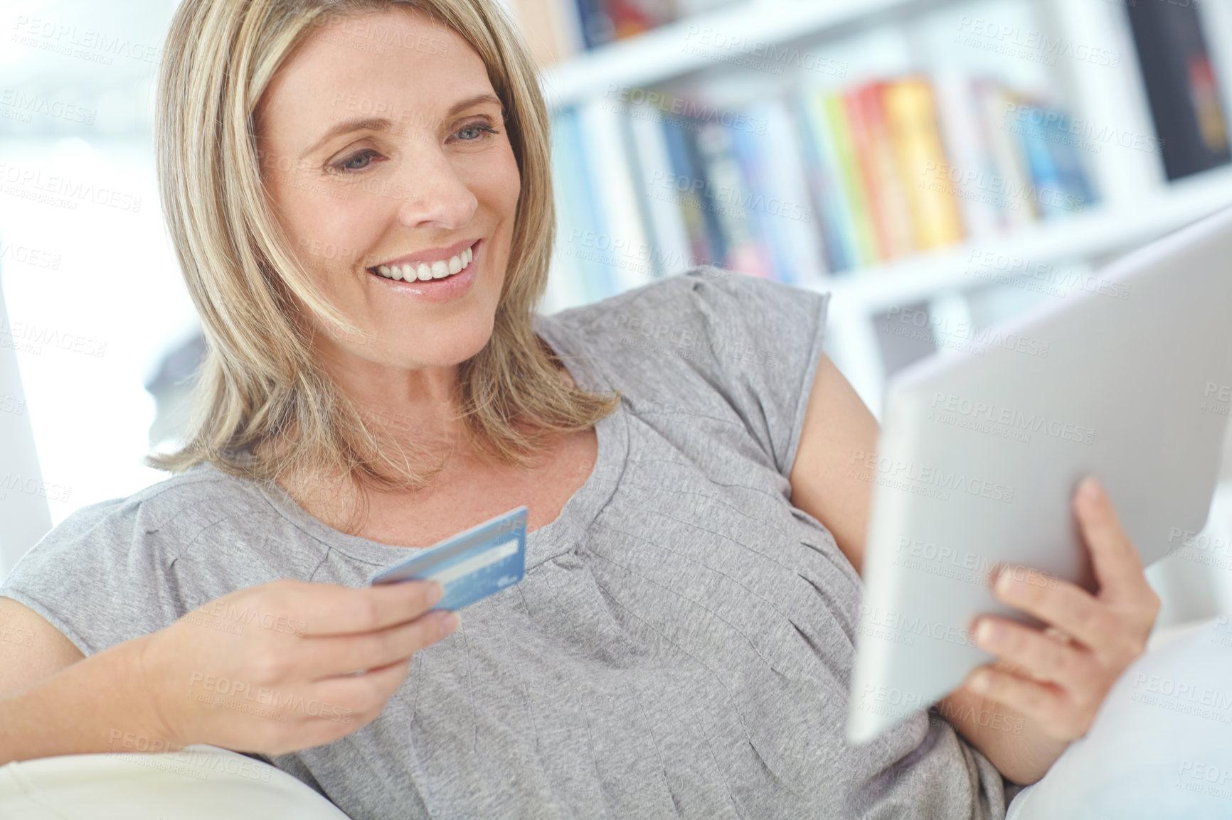 Buy stock photo Banking, credit card and happy woman with tablet in home for online shopping, investment and payment. Smile, technology and finance for ecommerce, money and virtual sales on discount in living room