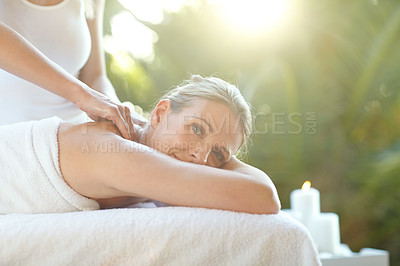 Buy stock photo Portrait of an attractive mature woman enjoying a massage at a day spa