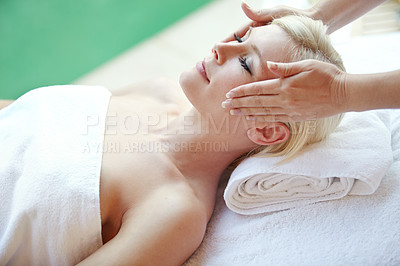 Buy stock photo Shot of a beautiful woman enjoying a head massage at a spa