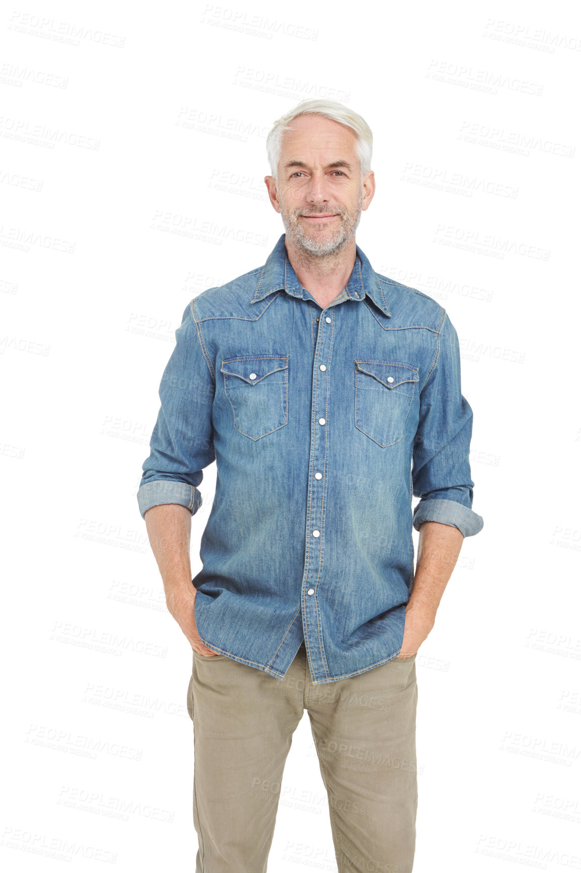 Buy stock photo Studio portrait of a handsome mature man standing with his hands in his pockets