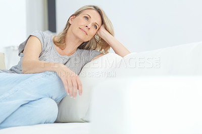 Buy stock photo Woman, sofa and relax for thinking, rest and memory in home living room for peace, quiet and mindfulness. Mature lady, couch and sitting for calm reflection in house, lounge or apartment in Australia