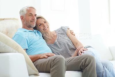 Buy stock photo Senior couple, retirement and thinking on a couch at home with love, care and support from life insurance. Commitment of a man and woman in a healthy marriage with security on living room couch