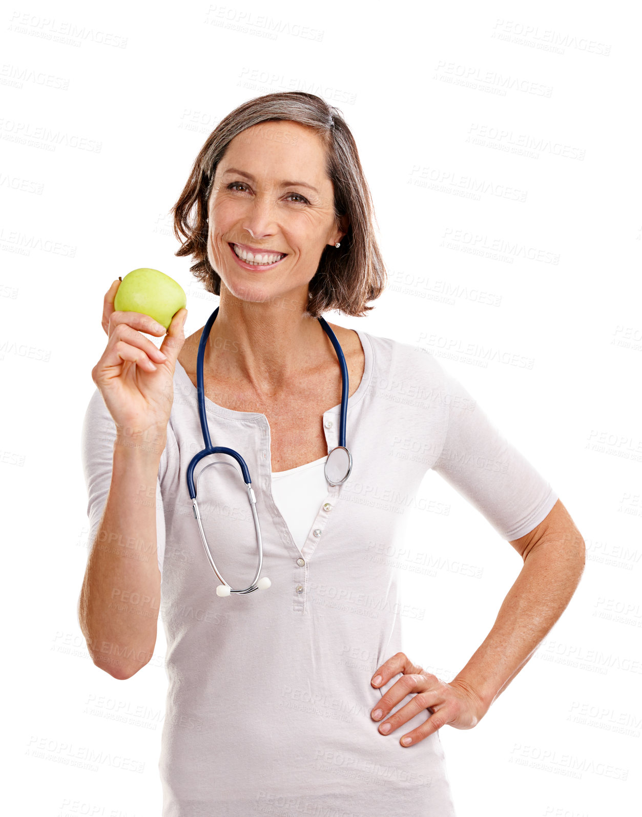 Buy stock photo Woman, doctor and happy with apple in studio on portrait with confidence for diet and nutrition on white background. Female person, dietitian and smile with fruit or healthy food for healthcare