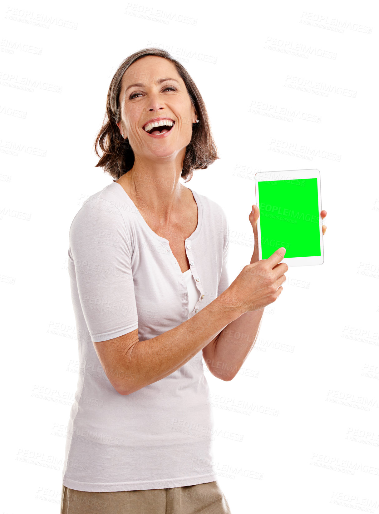 Buy stock photo Portrait, studio and mature woman with tablet, green screen and laughing for promotion of app and display. White background, advertising and person in space, smile and announcement of discount