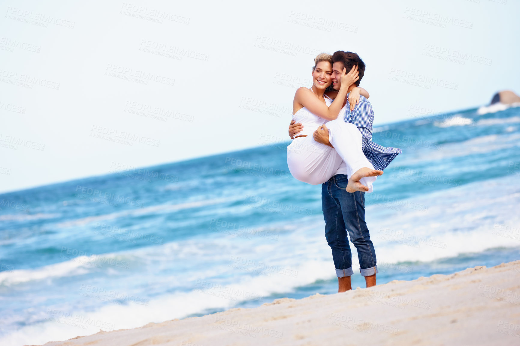 Buy stock photo Beach, carrying and fun for couple, waves and celebration of commitment, bonding and happy in relationship. Outdoor, man and woman on holiday, smile and together in nature, romance and date at sea