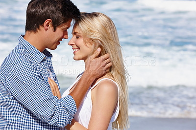 Buy stock photo Shot of a happy young couple enjoying a romantic moment outdoors