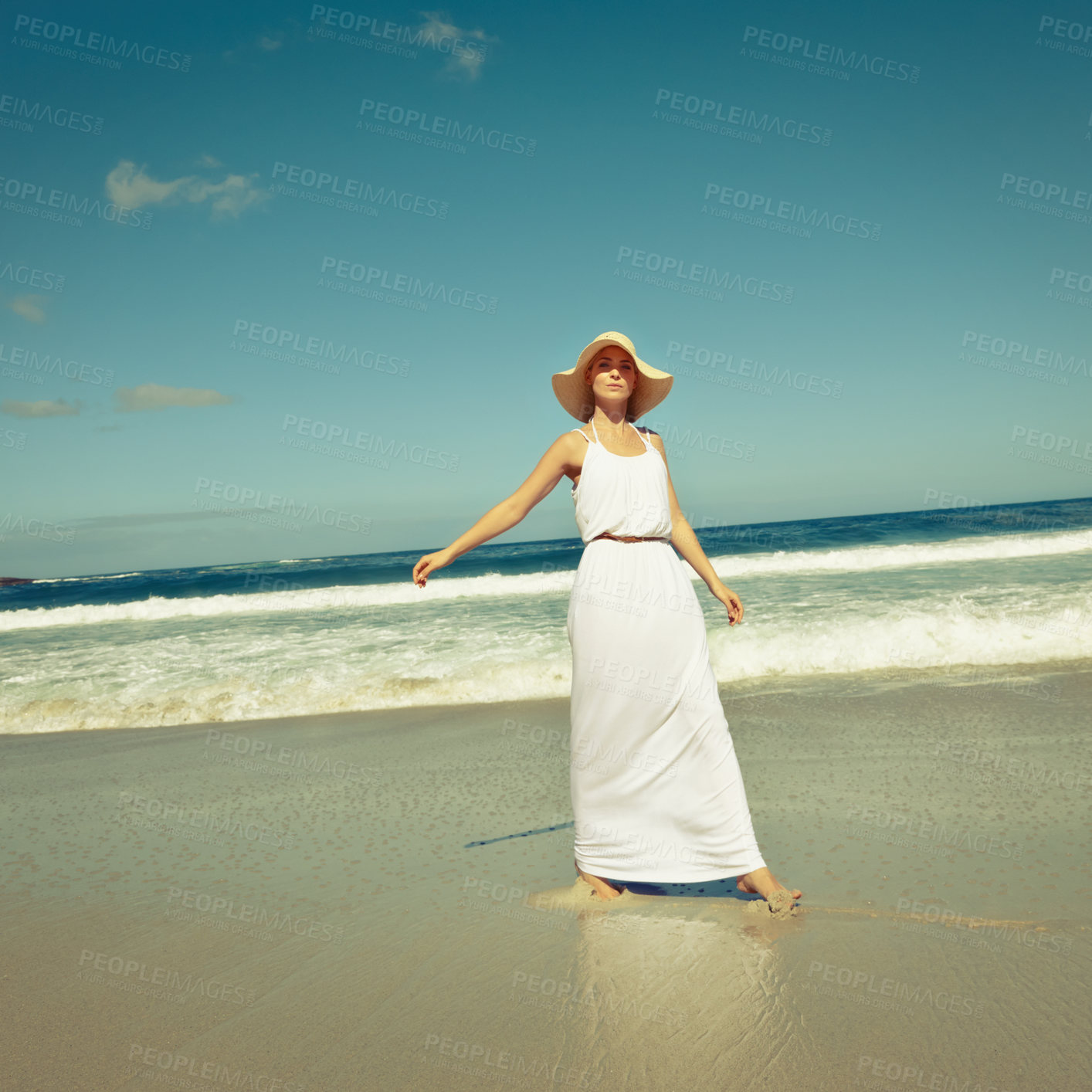 Buy stock photo Shot of a beautiful young woman enjoying a day at the beach