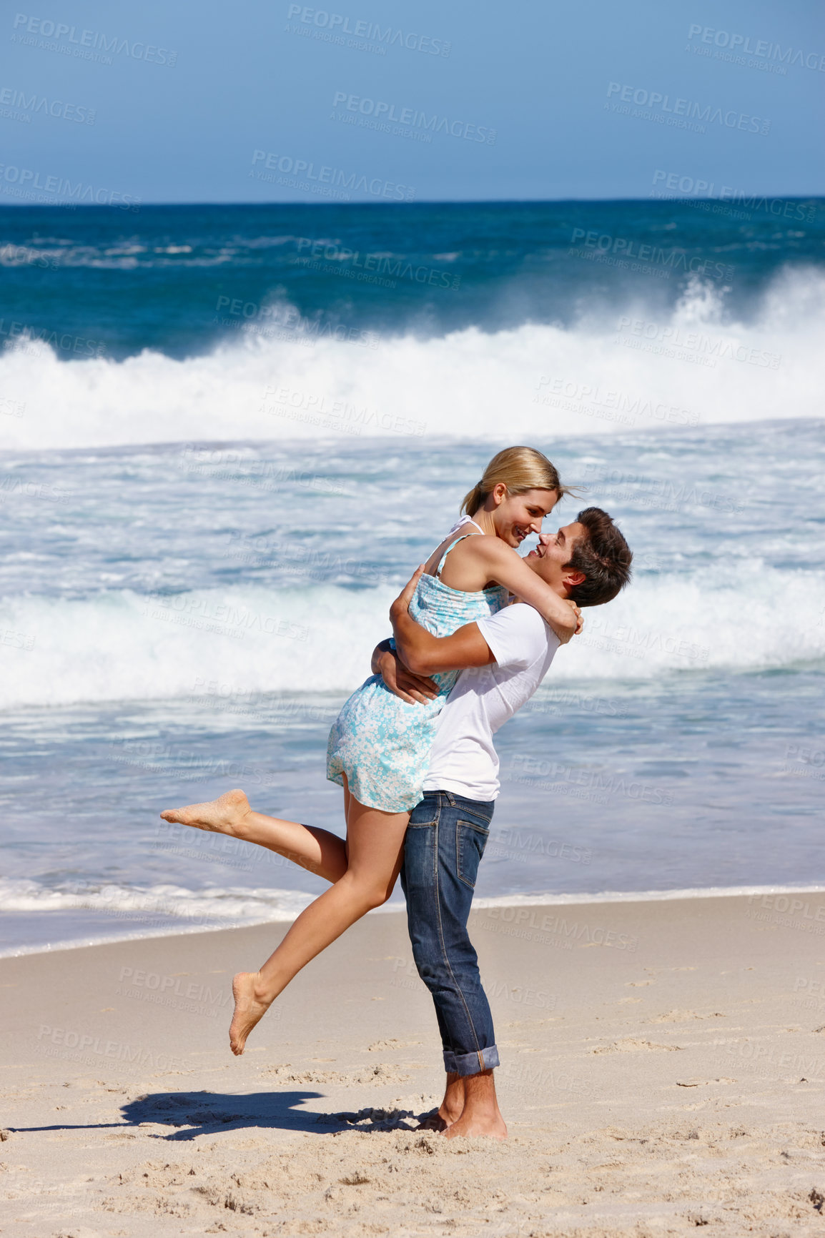 Buy stock photo Beach, carrying and fun for couple, hug and celebration of commitment, bonding and happy in relationship. Outdoor, man and woman on holiday, waves and together in nature, romance and date at sea