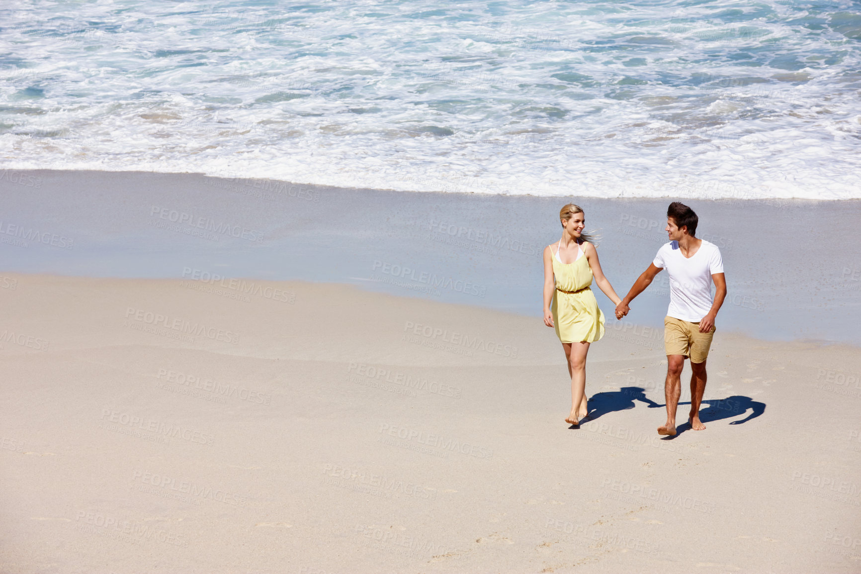 Buy stock photo Love, beach and happy couple holding hands on holiday, summer vacation or travel. Smile, man and woman on sand for support, romantic date or walking outdoor for healthy relationship with mockup space