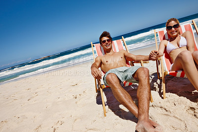 Buy stock photo Couple, happy and relax at beach for vacation, bonding and tropical holiday with holding hands. Man, woman and sunglasses outdoor for fun trip, love and travel with sunshine, smile and date in Ibiza