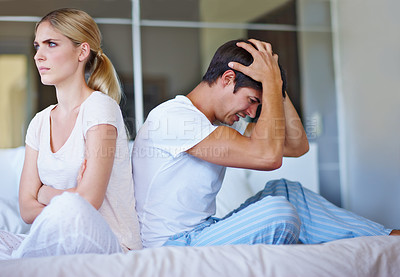 Buy stock photo Sad, couple and ignore in home for fight, disagreement and conflict for misunderstanding in marriage. House, woman and frustrated man with headache for affair, cheating partner or problem for divorce