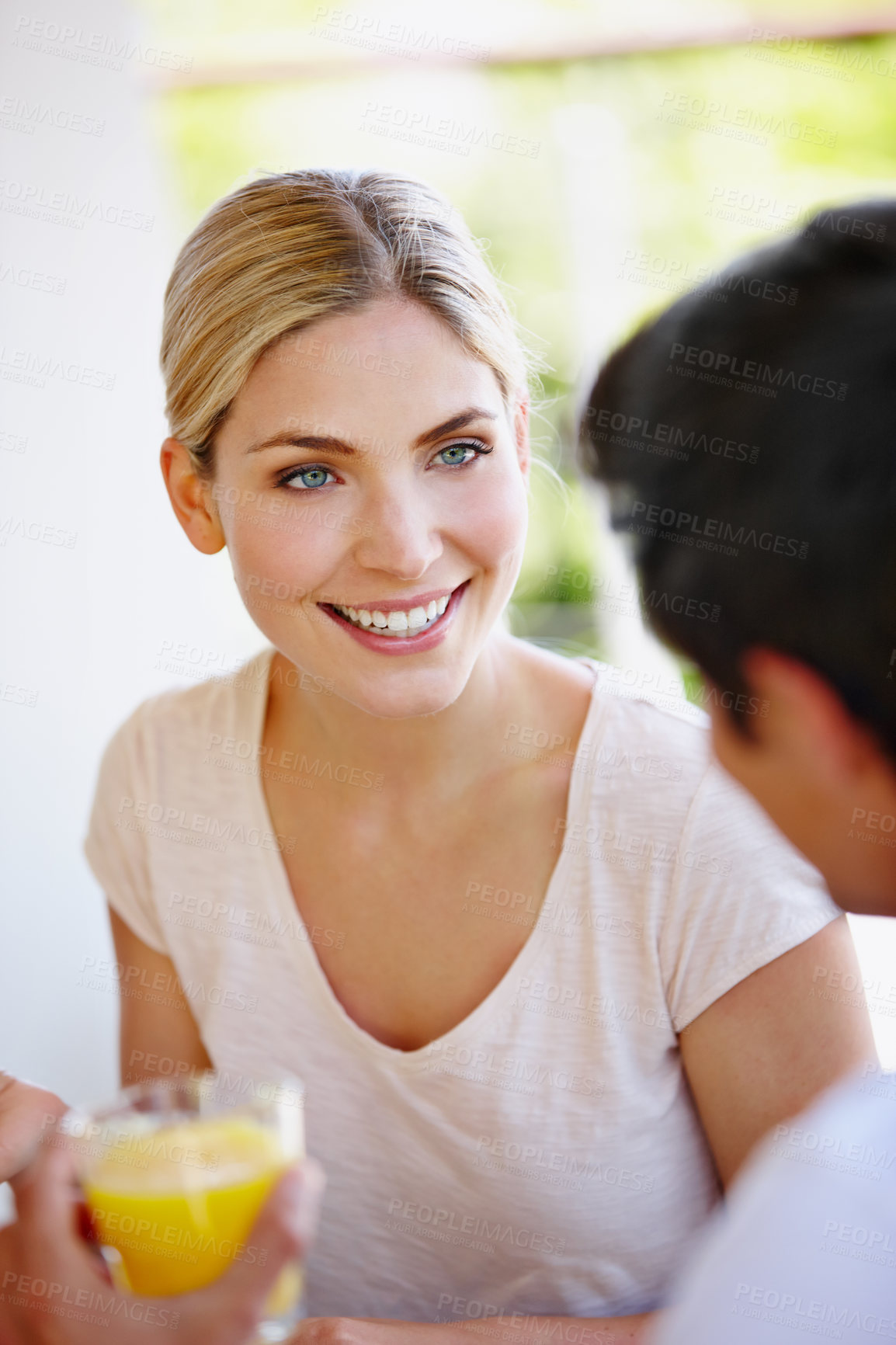 Buy stock photo Couple, home and happy on breakfast for discussion with nutrition, diet and health or love. People, relationship and conversation at patio with smile or juice for bonding, support and relaxing