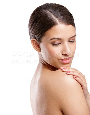 Buy stock photo Studio shot of a beautiful young woman looking over her shoulder against a white background