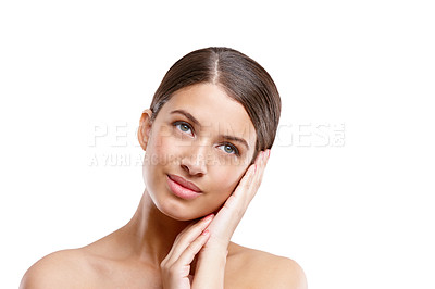 Buy stock photo Studio shot of a young woman with beautiful skin posing against a white background