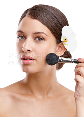 Buy stock photo Makeup, brush and portrait of woman in studio with flower, skincare and foundation for skin texture. Dermatology, cosmetics and girl with glow, natural beauty or blush application on white background