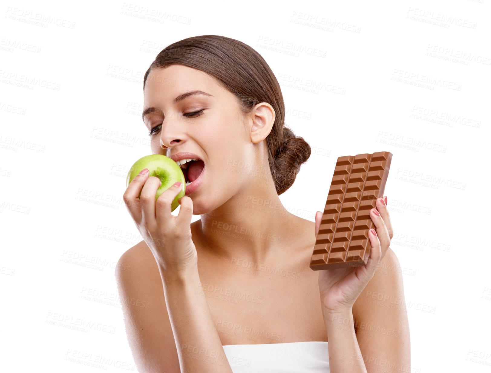 Buy stock photo Apple, bite and chocolate with woman in studio isolated on white background for choice or decision. Diet, health or nutrition and model eating fruit with temptation for cheating or losing weight