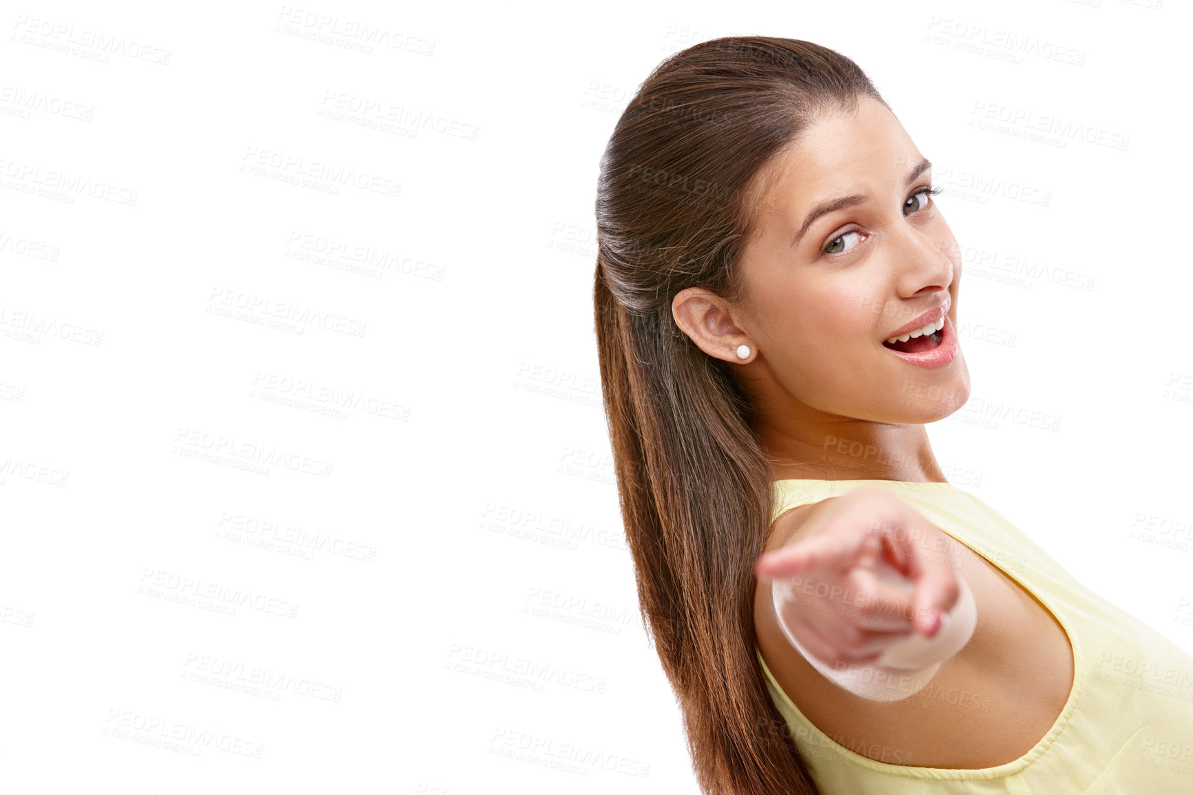 Buy stock photo Studio shot of a confident young woman pointing towards the camera against a white background