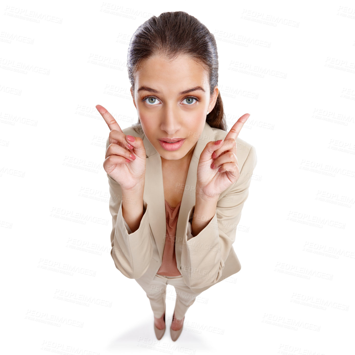 Buy stock photo High angle studio shot of a beautiful young businesswoman pointing towards something against a white background
