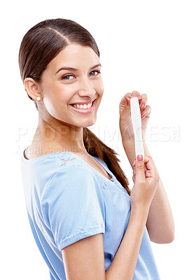 Buy stock photo Pregnancy test, happy and portrait of a woman in a studio with good, exciting and positive news. Happiness, smile and young female model with a prenatal urine kit isolated by a white background.