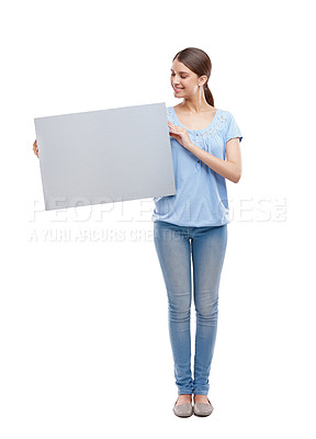 Buy stock photo Woman, blank board and happy standing in white background for advertising, marketing and branding vision. Model, smile and holding empty poster, billboard or news banner mockup isolated in studio