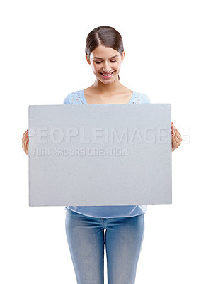 Buy stock photo Woman, poster and smile for marketing, advertising or branding against a white studio background. Happy isolated female model holding billboard for message, brand or advertisement on white background