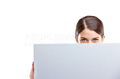 Buy stock photo Woman, marketing with sign and mockup in studio, product placement with blank poster isolated on white background. Advertising portrait, board and space, female eyes and vision, branding or promotion