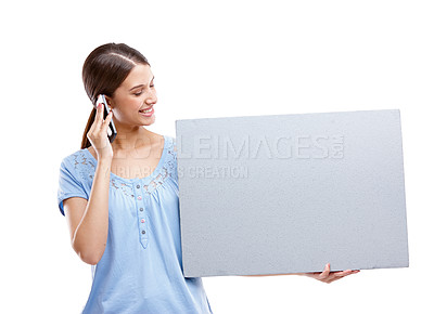 Buy stock photo Woman, studio and paper board with phone call for marketing, communication or networking by white background. Isolated model, using phone or holding branding billboard for vote, advertising or mockup