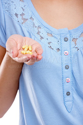 Buy stock photo Hand, medicine and pills with a woman in studio for healthcare, prescription medication or treatment. Tablet, medical and supplements with a female holding vitamins for nutrition, health or cure