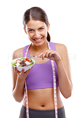 Buy stock photo Studio portrait of a beautiful young woman in sports wear holding a bowl of salad