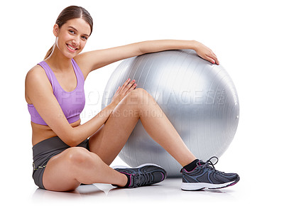 Buy stock photo Portrait of a young woman sitting next to her fitness ball
