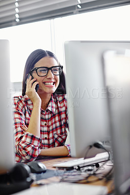 Buy stock photo Shot of a young designer talking on her phone