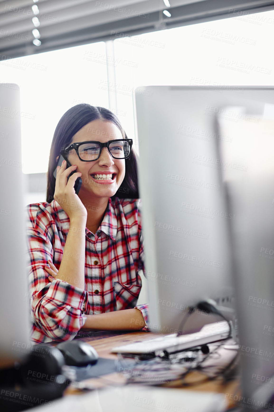 Buy stock photo Shot of a young designer talking on her phone