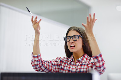 Buy stock photo Shot of a young designer looking displeased