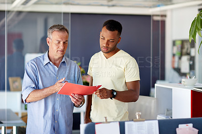 Buy stock photo Shot of two professionals working together in an office