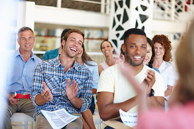 Buy stock photo Shot of coworkers applauding a presentation in a casual office environment