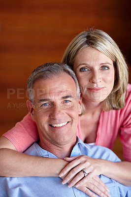 Buy stock photo Portrait of a husband and wife sharing an affectionate moment together at home