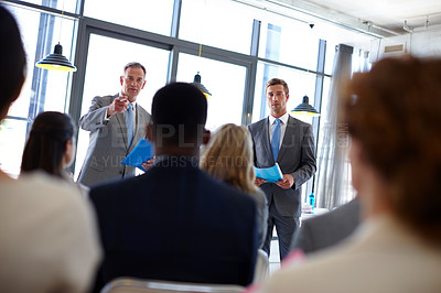 Buy stock photo Meeting, speaker and men with business people in conference, tradeshow and presentation. Corporate manager, professional audience and workers in office for seminar training, workshop and convention